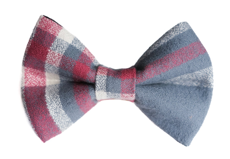 A textured plaid bow tie in muted red, slate blue, and off-white, shown against a plain white background.